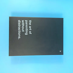 Book Decoy closed cover — matte black hardcover with the title 'the art of parenting without distractions'