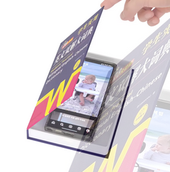 A smartphone tucked inside the Book Decoy tray, hidden from view